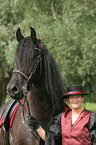 young woman with Friesian Horse