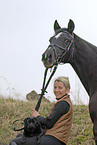 woman with horse and dog