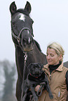 woman with horse and dog