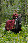 young woman riding Irish Tinker