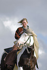 young woman riding Irish Tinker