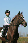 girl rides pony stallion