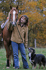 woman with horse and dog