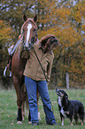 woman with horse and dog