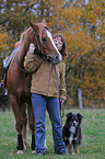 woman with horse and dog