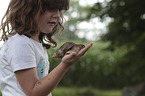 Child with African giant snail