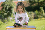 girl with Greek tortoise