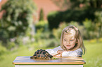 girl with Greek tortoise