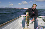 fisher with cod