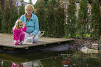 people at a Goldfish pond