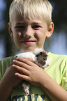 boy with Abyssinian guinea pig