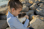 Girl with a dwarf rabbit