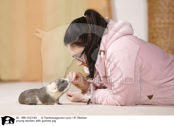 young woman with guinea pig / RR-102140