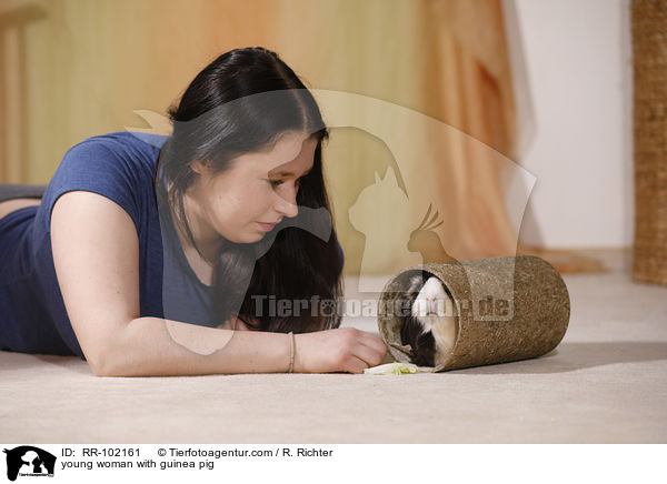 young woman with guinea pig / RR-102161