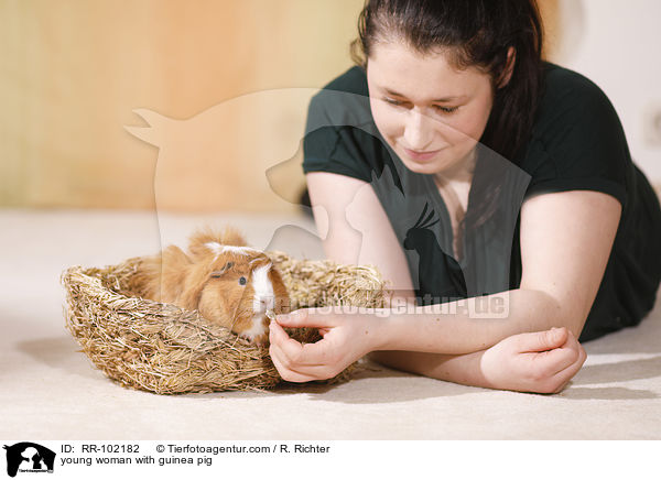 young woman with guinea pig / RR-102182