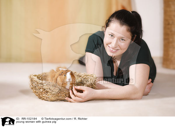 young woman with guinea pig / RR-102184