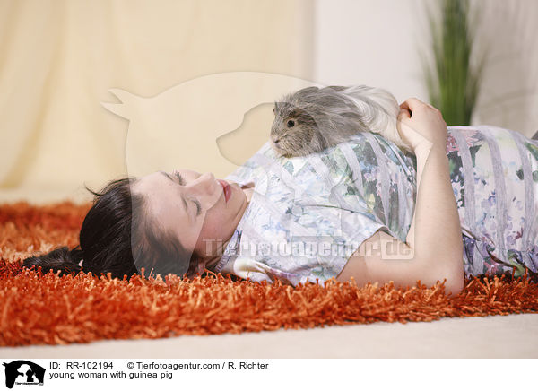 young woman with guinea pig / RR-102194