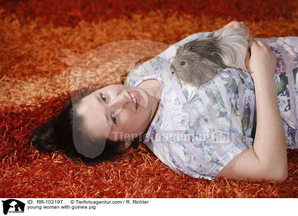 young woman with guinea pig / RR-102197