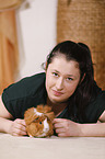 young woman with guinea pig