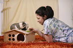 young woman with guinea pig