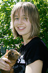 girl with smooth-hairedguinea pig
