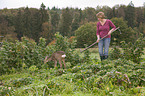 woman and young roe deer