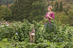 woman and young roe deer