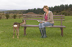 woman and young roe deer